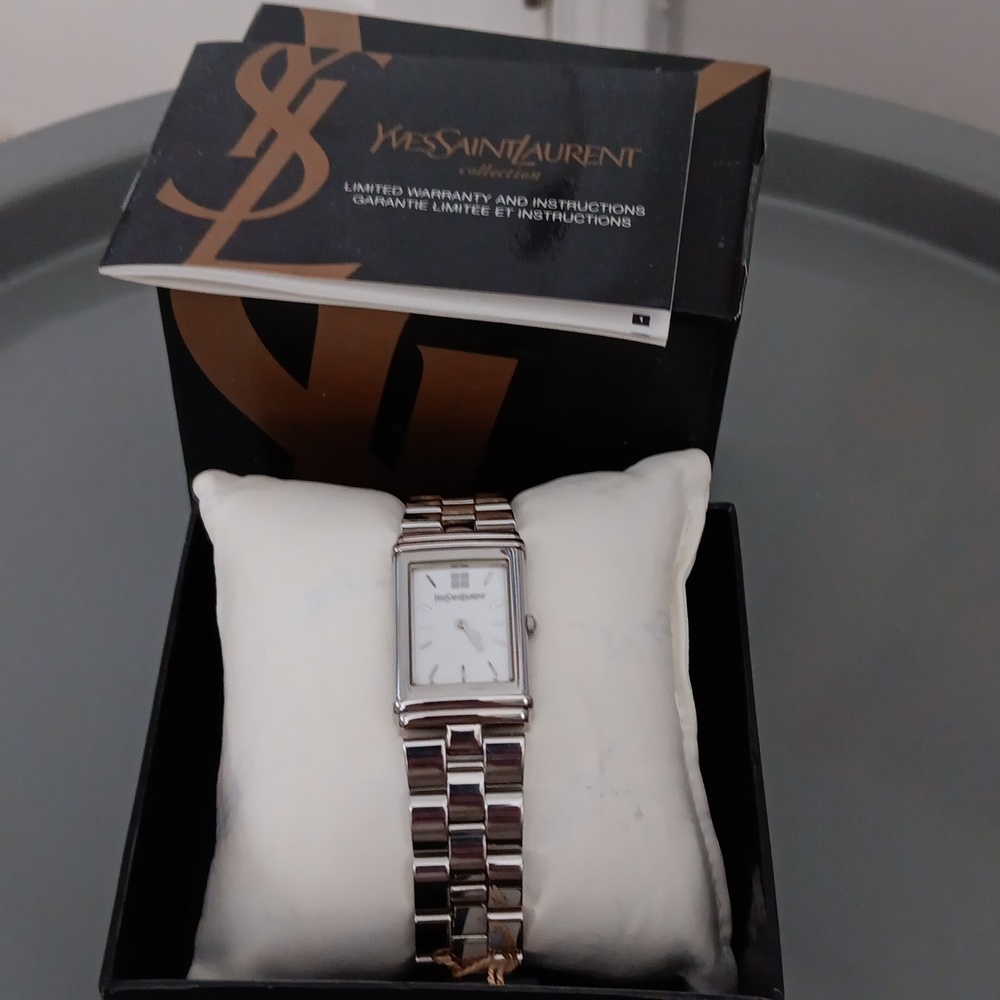 Vintage Yves Saint Laurent women's tank watch never worn Price firm